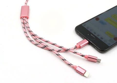 Three-in-one pink charging cable with Micro USB, TYPE-C, and USB connectors next to a smartphone.