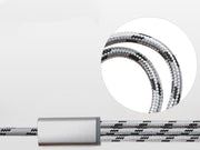 Close-up of a braided charging cable in silver and black, showcasing its durable design and connectors.