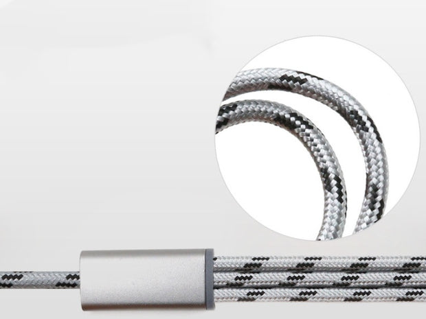 Close-up of a braided charging cable in silver and black, showcasing its durable design and connectors.