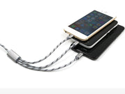Three-in-one USB cable charging multiple mobile phones, showcasing Micro USB and TYPE-C connections.